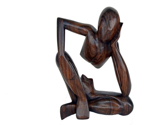 A person eating lunch slowly and mindfully at a wooden desk